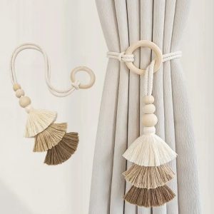 Decorative ring curtain tieback wit layered fan-shaped tassels in neutral tones and wooden beads